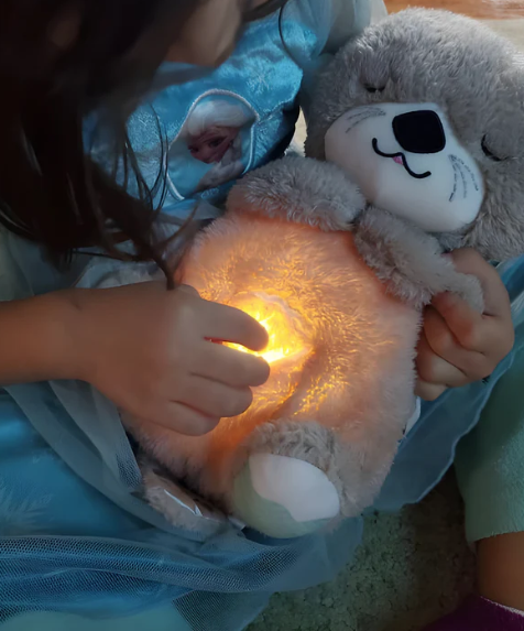Breathing otter plush toy for anxiety relief and sleep support.