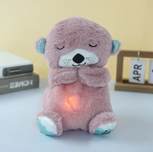 Plush teddy bear with a glowing heart on a light background