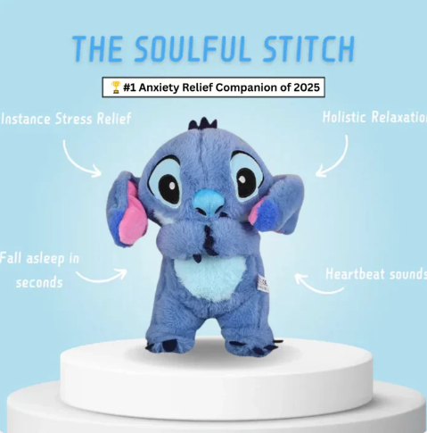 Blue plush toy with heart-shaped belly on a white pedestal against a light blue background, labeled 'The Soulful Stitch'