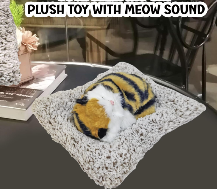 Plush toy resembling a cat with meow sound on a textured surface