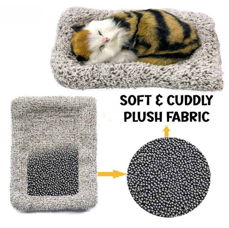 Cat sleeping on a soft plush fabric pet bed with close-up of material texture.