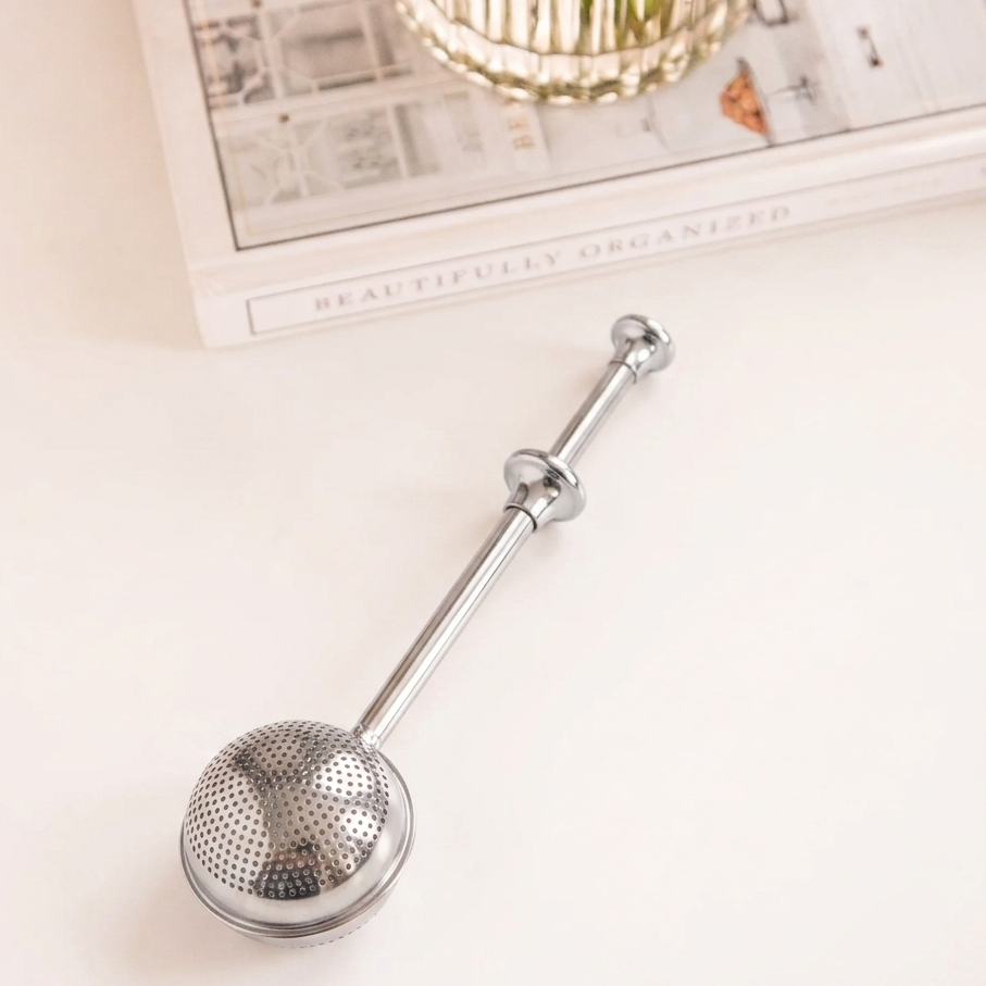 LittleCalm silver stainless steel sphere mesh tea infuser with decorative handle rings.